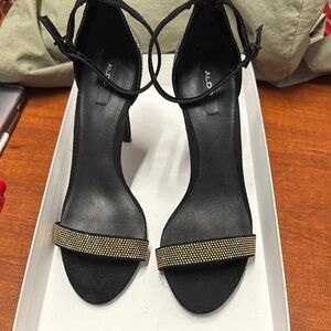 Aldo Black & Gold Stiletto Beaded Heels with Ankle Strap. Sz 6.5. 4.25” Heel.